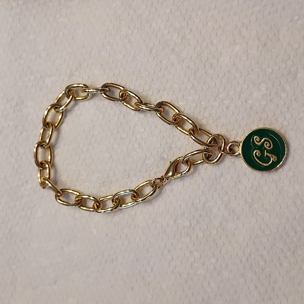 Girl Scout gold tone bracelet with green enamel GS charm